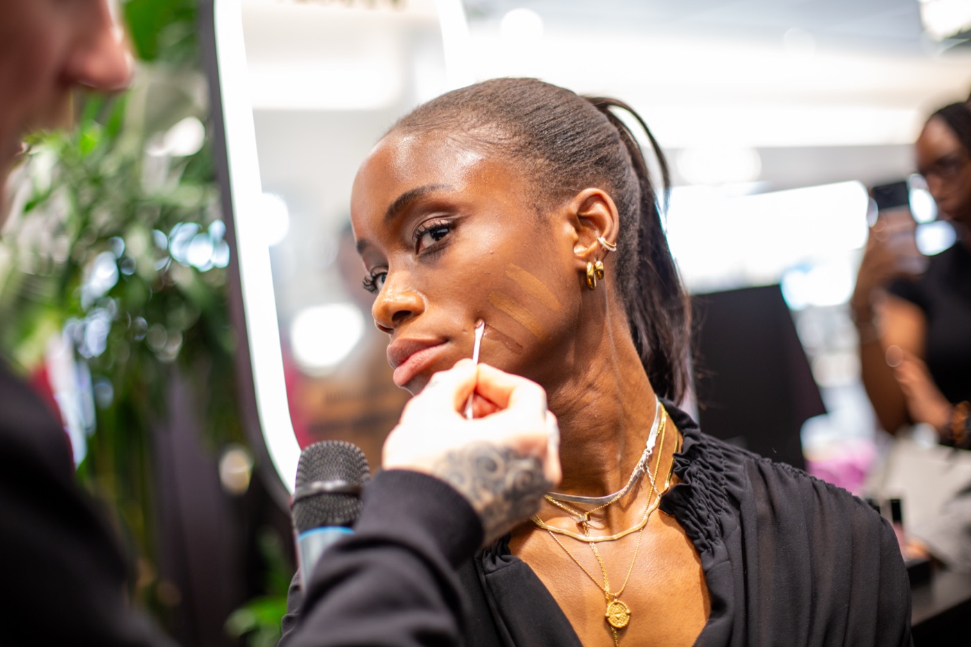 A make-up artist shade-matching a guest at the Armani Beauty counter at the Armani Beauty Luminous Silk Foundation masterclass